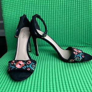 Black suede-like floral open toe heels